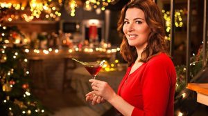 Domestic Goddess Nigella smiling jubilantly with her Christmas Martini